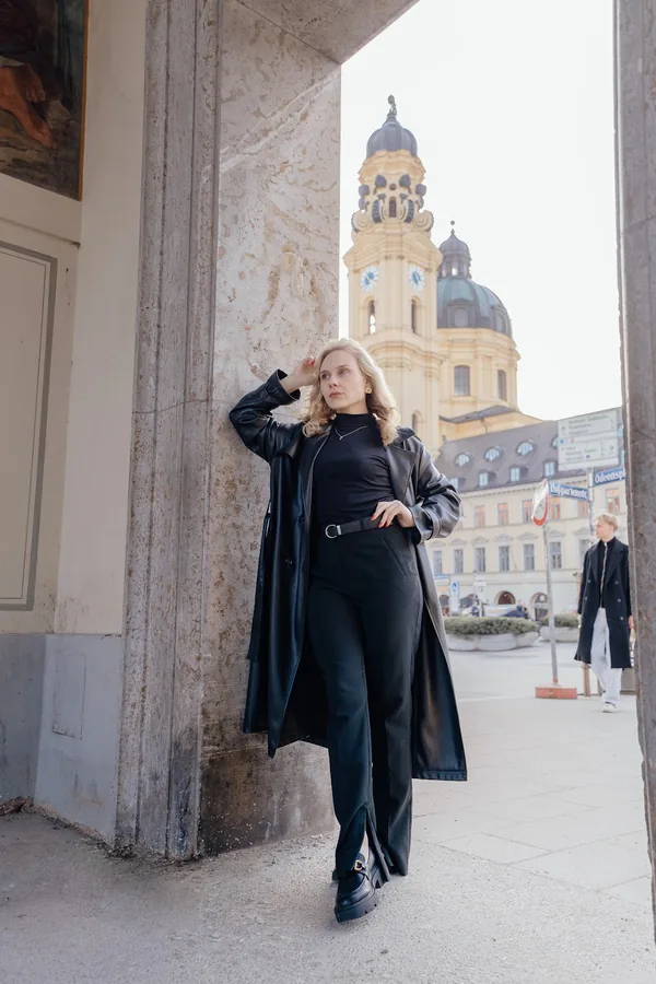 Portrait at the Hofgarten gate with the Theatine Church in the background.